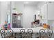 Efficient white kitchen with breakfast bar, stainless steel appliances, and ample counter space at 118 Tuscany Villas Dr, Edgewater, FL 32141