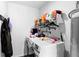 Functional laundry room with modern washer and dryer, storage shelves, and a water heater for efficiency at 118 Tuscany Villas Dr, Edgewater, FL 32141