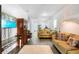 Bright living room features wood floors, neutral walls, with sofas and decor and an entry to the Kitchen at 118 Tuscany Villas Dr, Edgewater, FL 32141