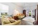 Inviting living room featuring modern decor, wood-look floors, and ample seating at 118 Tuscany Villas Dr, Edgewater, FL 32141