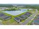 Aerial view of the community showcasing the beautiful lakes, lush greenery, and well-maintained homes at 141 Mosaic Blvd, Daytona Beach, FL 32124