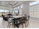 Bright dining area with large windows, seamlessly connected to the living room and offering serene outdoor views at 141 Mosaic Blvd, Daytona Beach, FL 32124