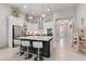 Open-concept kitchen featuring a large island with seating, modern appliances, and ample storage at 141 Mosaic Blvd, Daytona Beach, FL 32124
