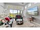 Cozy living room with a view of the lake, seamlessly connected to the outdoor space through sliding glass doors at 141 Mosaic Blvd, Daytona Beach, FL 32124