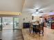 Spacious dining area next to modern kitchen with stainless steel appliances at 1516 Arrowhead Trl, Enterprise, FL 32725