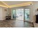 Bright living room with sliding glass doors leading to screened-in pool at 1516 Arrowhead Trl, Enterprise, FL 32725