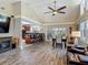 Spacious living area with vaulted ceilings, bar seating, and access to patio and kitchen at 1516 Arrowhead Trl, Enterprise, FL 32725