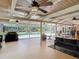 Covered outdoor living area that includes views of the pool, outdoor seating, and a grill at 1516 Arrowhead Trl, Enterprise, FL 32725