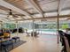 Stylish outdoor living space with comfortable seating and views of the screened pool at 1516 Arrowhead Trl, Enterprise, FL 32725
