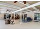 Expansive covered patio with a built-in bar, lounge area, and dining space at 1516 Arrowhead Trl, Enterprise, FL 32725
