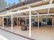 Expansive covered patio for outdoor living and entertaining, with multiple seating areas at 1516 Arrowhead Trl, Enterprise, FL 32725