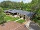 Aerial view of the home highlighting the well-kept yard and architectural design at 1555 Mercers Fernery Rd, Deland, FL 32720