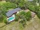 Expansive property featuring a refreshing pool and well-maintained grounds, perfect for outdoor living at 1555 Mercers Fernery Rd, Deland, FL 32720