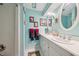 Bright bathroom featuring double sinks, mirrors, and a separate shower area at 1555 Mercers Fernery Rd, Deland, FL 32720