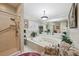 Bathroom boasting a jetted tub, tile floors, a shower, and large mirrors at 1555 Mercers Fernery Rd, Deland, FL 32720