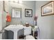 Stylish half bathroom featuring a pedestal sink and tasteful decor at 1555 Mercers Fernery Rd, Deland, FL 32720