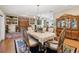 Elegant dining room with hardwood floors, ornate furniture, and decorative hutch at 1555 Mercers Fernery Rd, Deland, FL 32720