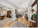 Warm and inviting foyer showcasing hardwood floors and seamless transition to living spaces at 1555 Mercers Fernery Rd, Deland, FL 32720