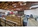Lofted garage interior with shelves, storage bins, and natural light, for ample space at 1555 Mercers Fernery Rd, Deland, FL 32720