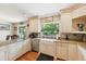 Kitchen featuring stainless steel appliances, large window, and farm style sink at 1555 Mercers Fernery Rd, Deland, FL 32720