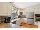 Updated kitchen featuring stainless steel appliances, granite countertops, and modern cabinetry at 1555 Mercers Fernery Rd, Deland, FL 32720