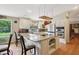 Gourmet kitchen featuring granite countertops, stainless steel appliances and a pot rack at 1555 Mercers Fernery Rd, Deland, FL 32720