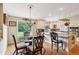 Bright kitchen with stainless steel appliances, granite countertops, and glass table at 1555 Mercers Fernery Rd, Deland, FL 32720