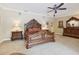 Main bedroom with hardwood furniture including nightstands, bed frame, and dresser at 1555 Mercers Fernery Rd, Deland, FL 32720
