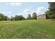 Expansive green pasture featuring healthy grass cover and mature shade trees at 1555 Mercers Fernery Rd, Deland, FL 32720