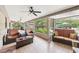 Spacious screened-in patio with tile flooring and view of pool and backyard at 1555 Mercers Fernery Rd, Deland, FL 32720