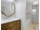 Modern bathroom featuring a stylish vanity, marble counter, and a soaking tub at 1620 20Th St, Orange City, FL 32763