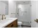 Modern bathroom featuring white subway tile, glass enclosed shower, updated vanity, and brushed gold fixtures at 1620 20Th St, Orange City, FL 32763
