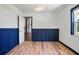 Bright bedroom featuring decorative lighting, hardwood floors, fresh paint, and natural light from a large window at 1620 20Th St, Orange City, FL 32763