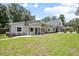 Attractive single-Gathering home with stone and siding exterior, and a well-manicured lawn at 1620 20Th St, Orange City, FL 32763