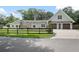 Charming home features a two-car garage with pergola and well-maintained landscaping at 1620 20Th St, Orange City, FL 32763