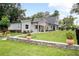 Landscaped front yard with stone accents and well-maintained lawn at 1620 20Th St, Orange City, FL 32763