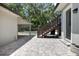 Exterior patio and staircase leading to an upper level with a view of the backyard pool at 1620 20Th St, Orange City, FL 32763