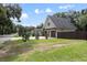 Charming home features a two-car garage with pergola and well-maintained landscaping at 1620 20Th St, Orange City, FL 32763
