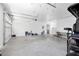 Large garage space with lots of storage and parking space for a vehicle at 1620 20Th St, Orange City, FL 32763