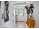 Hallway features white cabinets, a wooden floor, and a door to the exterior at 1620 20Th St, Orange City, FL 32763