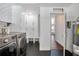 Spacious laundry room equipped with modern washer, dryer, and ample cabinet space at 1620 20Th St, Orange City, FL 32763