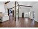Spacious living room with high ceilings, wood beams, fireplace, and hardwood floors at 1620 20Th St, Orange City, FL 32763