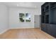 Bright living room featuring hardwood floors and built-in shelving at 1620 20Th St, Orange City, FL 32763