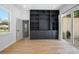 Bright living room featuring hardwood floors, built-in shelving and backyard view at 1620 20Th St, Orange City, FL 32763