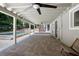 Expansive covered patio with brick pavers, views of the pool, and ample space for outdoor enjoyment at 1620 20Th St, Orange City, FL 32763