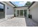Pavered patio with sliding glass doors, creating an inviting outdoor living space at 1620 20Th St, Orange City, FL 32763
