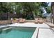Inviting pool area with lounge chairs, a playhouse, mature trees, and plenty of space for relaxation at 1620 20Th St, Orange City, FL 32763