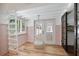 Inviting sunroom with wooden floors, hanging chair, pastel wainscoting, and natural light at 1620 20Th St, Orange City, FL 32763
