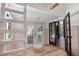 Inviting sunroom with wooden floors, hanging chair, pastel wainscoting, and natural light at 1620 20Th St, Orange City, FL 32763