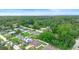 Aerial view of a charming neighborhood showcasing lush greenery and well-maintained homes at 1725 12Th St, Orange City, FL 32763
